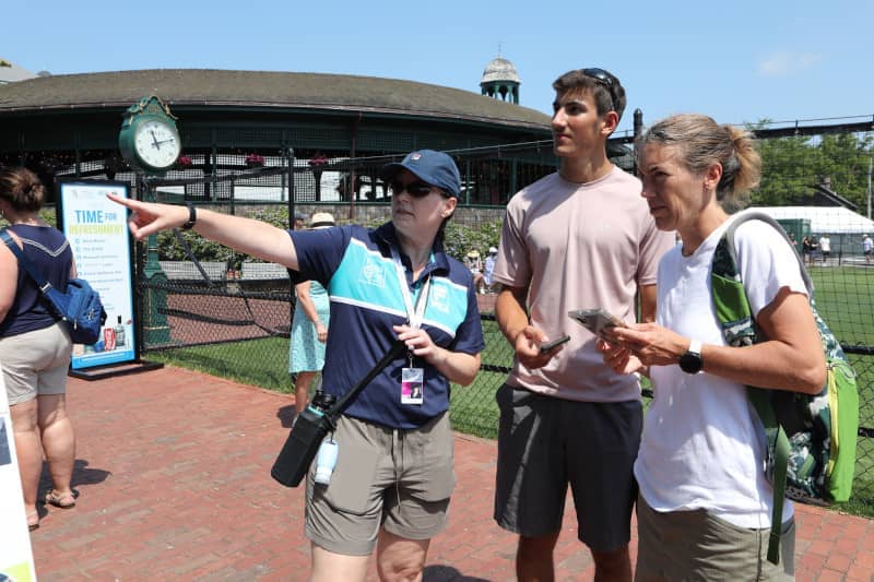 A volunteer directing tournament Spectators